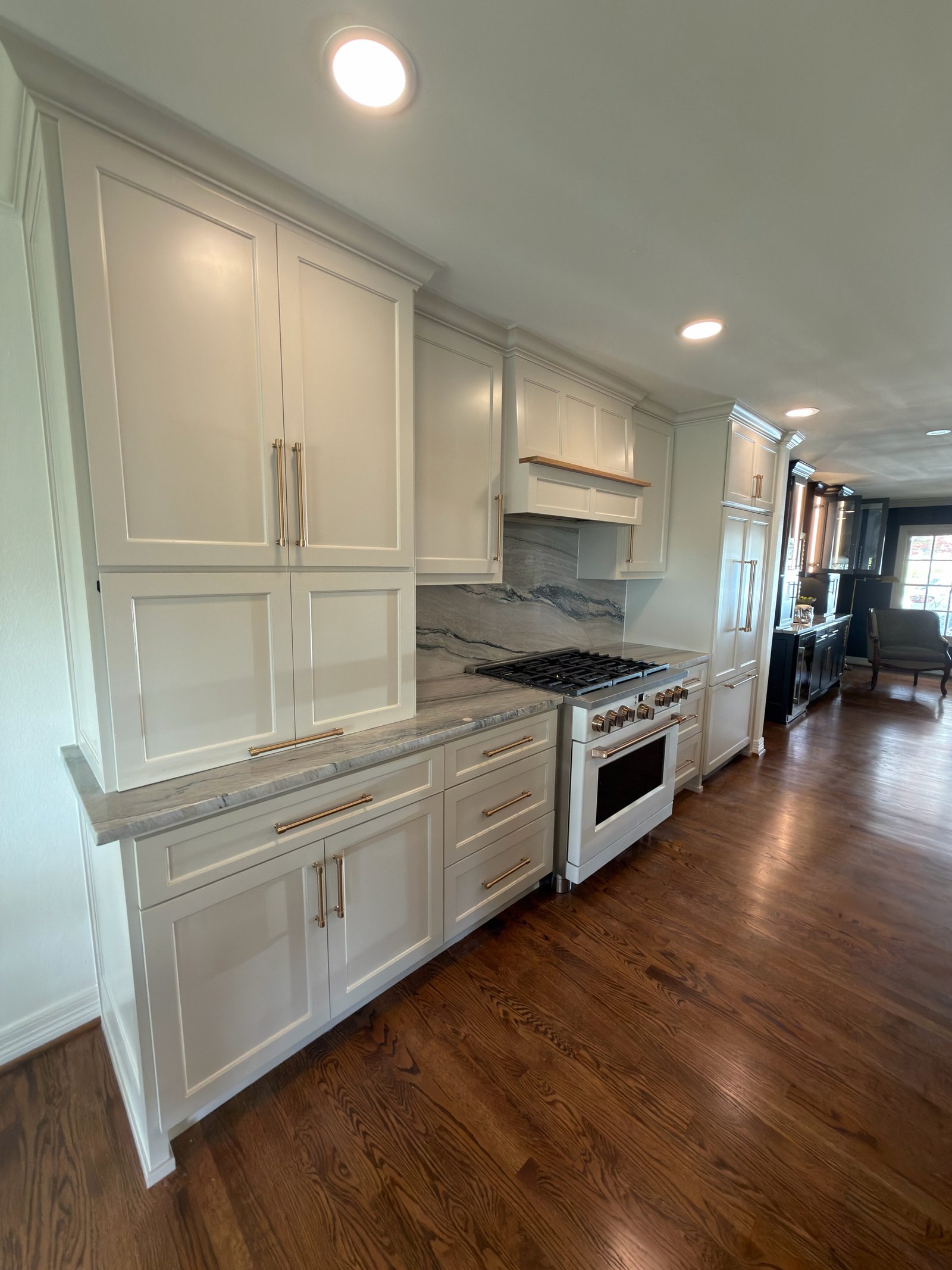 White shaker kitchen with marble backsplash