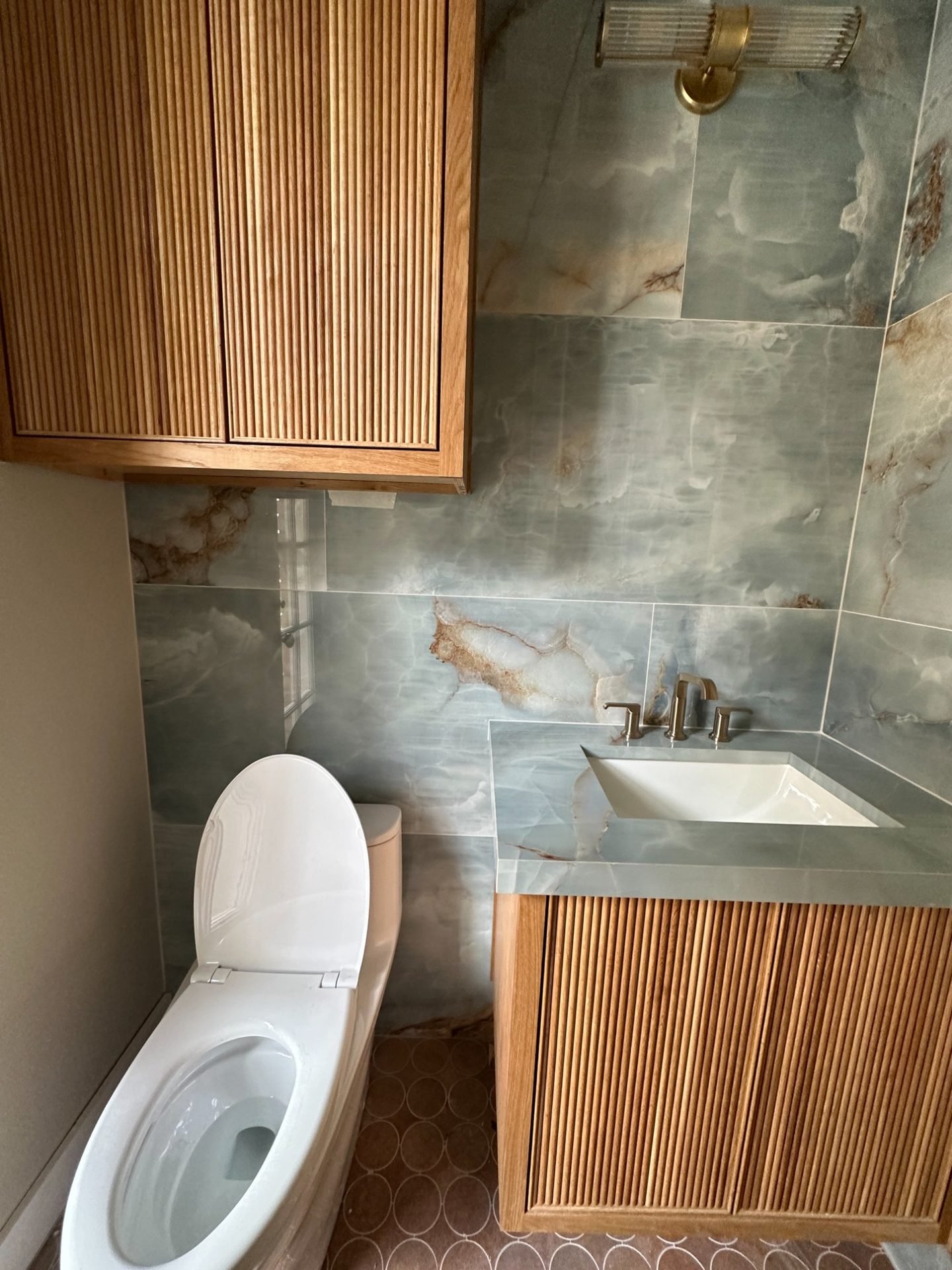 Custom fluted bathroom vanity in powder room