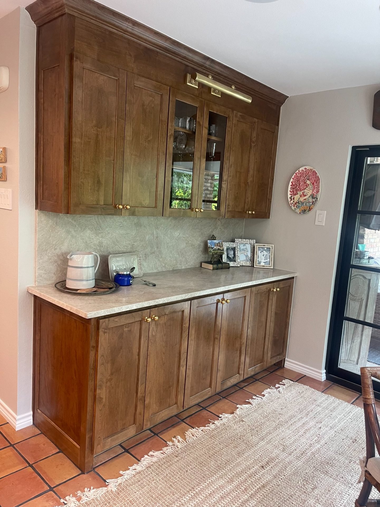 Wood kitchen butler pantry with brass hardware